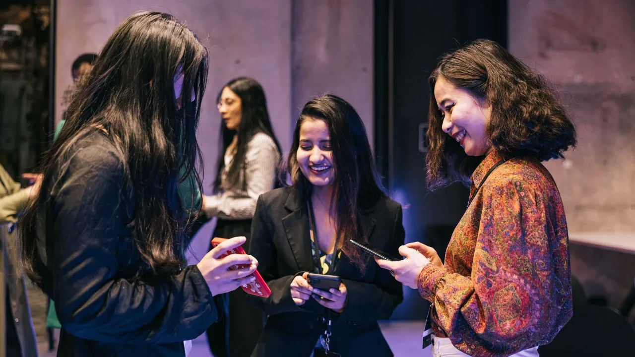 girls at event using technology